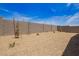 Low maintenance backyard with gravel ground cover and a block wall for privacy at 18156 W Cielo Grande Ave, Surprise, AZ 85387