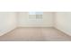 Bright bedroom with neutral carpet and natural light from a window at 18156 W Cielo Grande Ave, Surprise, AZ 85387