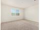 Cozy bedroom with neutral carpet, providing a serene and comfortable atmosphere at 18156 W Cielo Grande Ave, Surprise, AZ 85387
