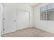 Inviting bedroom featuring a closet and a window bringing in natural light at 18156 W Cielo Grande Ave, Surprise, AZ 85387