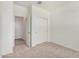Bedroom featuring a closet and a doorway offering seamless transitions at 18156 W Cielo Grande Ave, Surprise, AZ 85387