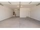 Spacious garage with concrete floor, door to the side yard, and water heater at 18156 W Cielo Grande Ave, Surprise, AZ 85387
