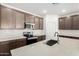 Modern kitchen features stainless steel appliances, white subway tile backsplash, and quartz countertops at 18156 W Cielo Grande Ave, Surprise, AZ 85387