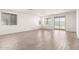 Bright and spacious living area with tile floors and natural light from windows and sliding glass doors at 18156 W Cielo Grande Ave, Surprise, AZ 85387