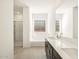 Bright bathroom boasts double sinks, a soaking tub, and a walk-in shower at 36893 W La Paz St, Maricopa, AZ 85138