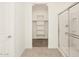 Spacious bathroom with a walk-in shower and built-in shelving at 36893 W La Paz St, Maricopa, AZ 85138