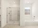 Modern bathroom featuring a large walk-in shower and separate tub at 36893 W La Paz St, Maricopa, AZ 85138