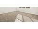 Simple carpeted bedroom with neutral walls and natural light at 36893 W La Paz St, Maricopa, AZ 85138