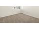 Simple bedroom with neutral carpeting and a window at 36893 W La Paz St, Maricopa, AZ 85138