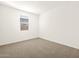 Bright bedroom with neutral carpeting at 36893 W La Paz St, Maricopa, AZ 85138
