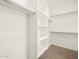 Large walk-in closet with ample shelving and hanging space at 36893 W La Paz St, Maricopa, AZ 85138