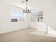 Bright dining room with tile floors and a modern chandelier at 36893 W La Paz St, Maricopa, AZ 85138
