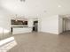 Modern kitchen with dark cabinetry, granite countertops and stainless steel appliances at 36893 W La Paz St, Maricopa, AZ 85138