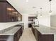 Modern kitchen with stainless steel appliances and granite countertops at 36893 W La Paz St, Maricopa, AZ 85138