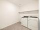 Laundry room with washer and dryer hookups at 36893 W La Paz St, Maricopa, AZ 85138