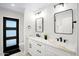 Modern bathroom with double vanity and updated fixtures at 5919 N 45Th St, Phoenix, AZ 85018