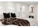 Relaxing bedroom with king-size bed, plush bedding, and ensuite bathroom access at 5919 N 45Th St, Phoenix, AZ 85018