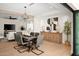 Modern dining room with a rustic wooden table and gray chairs at 5919 N 45Th St, Phoenix, AZ 85018