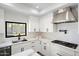 Sleek kitchen featuring white cabinetry, quartz countertops, and a contemporary design at 5919 N 45Th St, Phoenix, AZ 85018