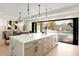 Island kitchen with marble countertops and opens to a view of the pool at 5919 N 45Th St, Phoenix, AZ 85018