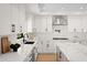 Modern kitchen with white cabinets, quartz countertops, and stainless steel appliances at 5919 N 45Th St, Phoenix, AZ 85018