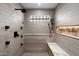 Modern shower with multiple shower heads and built-in seat at 5919 N 45Th St, Phoenix, AZ 85018