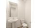 Clean bathroom with pedestal sink, toilet and mirror at 36894 W La Paz St, Maricopa, AZ 85138