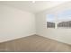 Simple bedroom with carpeted flooring and neutral wall colors at 36894 W La Paz St, Maricopa, AZ 85138