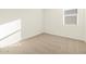 Bright bedroom with neutral carpeting and window coverings at 36894 W La Paz St, Maricopa, AZ 85138