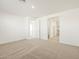 Spacious bedroom with carpet flooring and access to a bathroom at 36894 W La Paz St, Maricopa, AZ 85138