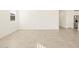 Bright dining room with tile floors and access to kitchen at 36894 W La Paz St, Maricopa, AZ 85138