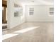 Open and airy dining room with tile floors and backyard access at 36894 W La Paz St, Maricopa, AZ 85138