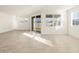 Sunlit dining room featuring tile floors and sliding glass doors at 36894 W La Paz St, Maricopa, AZ 85138