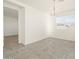 Bright dining room with tile flooring and chandelier at 36894 W La Paz St, Maricopa, AZ 85138