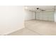 Attached garage with light-colored flooring and overhead door at 36894 W La Paz St, Maricopa, AZ 85138