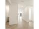 Bright hallway with tile flooring and access to bathroom and other rooms at 36894 W La Paz St, Maricopa, AZ 85138