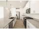 Spacious kitchen boasts granite island, stainless steel appliances, and stylish pendant lighting at 36894 W La Paz St, Maricopa, AZ 85138