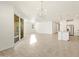 Open living room and kitchen area with tile flooring at 36894 W La Paz St, Maricopa, AZ 85138