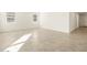 Spacious living room with tile floors and natural light at 36894 W La Paz St, Maricopa, AZ 85138