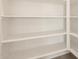 Bright and spacious pantry with ample shelving for storage at 36894 W La Paz St, Maricopa, AZ 85138