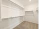 Large walk-in closet with ample shelving and hanging space at 36894 W La Paz St, Maricopa, AZ 85138