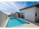 Backyard pool with a patio, chairs, and a privacy wall, offering a relaxing outdoor living space at 812 E Summerside Rd, Phoenix, AZ 85042