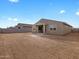 Large backyard features covered patio and block wall at 4958 W Hunter Trl, San Tan Valley, AZ 85144