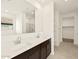 Bathroom with double sinks and a closet at 4958 W Hunter Trl, San Tan Valley, AZ 85144