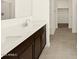 Bathroom with double sinks and tiled flooring at 4958 W Hunter Trl, San Tan Valley, AZ 85144