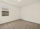 Bright bedroom with plush carpet and a window at 4958 W Hunter Trl, San Tan Valley, AZ 85144