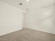 A bright bedroom features carpet and a door at 4958 W Hunter Trl, San Tan Valley, AZ 85144