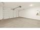 Spacious garage with a roll up door at 4958 W Hunter Trl, San Tan Valley, AZ 85144