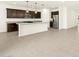 Modern kitchen with pendant lighting, stainless steel appliances, and a kitchen island at 4958 W Hunter Trl, San Tan Valley, AZ 85144