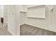 Spacious walk-in closet with carpet floor, shelves, and hanging rods at 4958 W Hunter Trl, San Tan Valley, AZ 85144